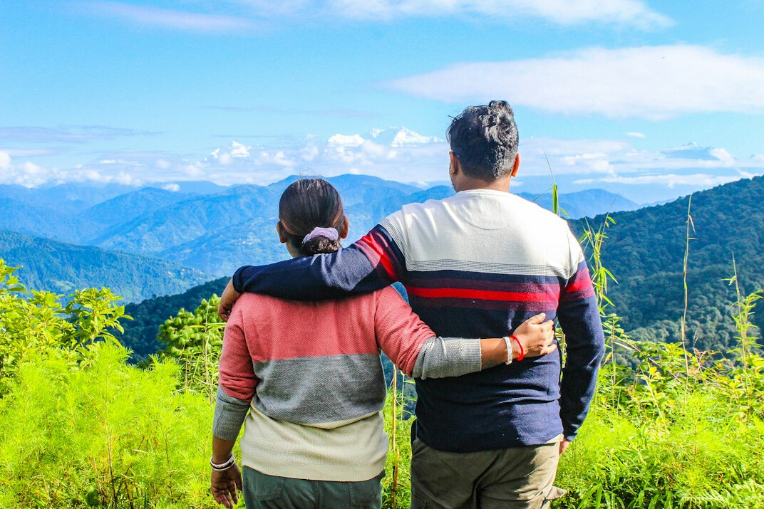 senior couple hiking mountains